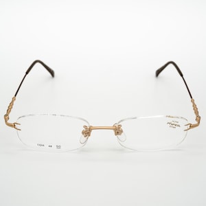 Hoya pinfeel vintage eyeglasess, titan, rimless optical frame made in Japan, gold, new old stock