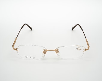 Hoya pinfeel vintage eyeglasess, oval rimless frame made in Hoya pinfeel vintage eyeglasess, oval rimless frame made in