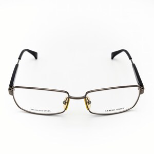 May include: Rectangular eyeglasses with a dark metal frame and black temples. The lenses are clear, and the frame has the text "STAINLESS STEEL" and "GIORGIO ARMANI". The glasses are set against a white background.