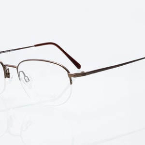 Charmant premier vintage eyeglases, half rim titanium frame, no nickel allergy, new old stock
