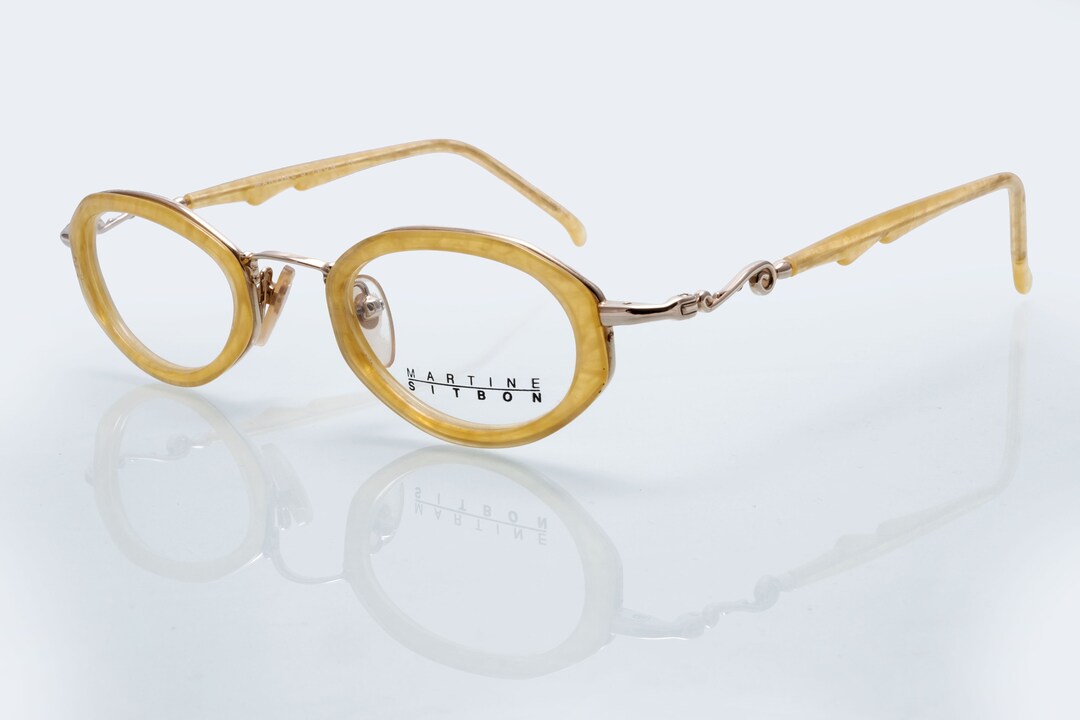 Martine Sitbon black framed sunglasses with dark red brown lenses