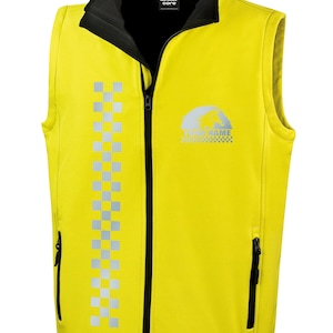 May include: A yellow safety vest with a black zipper and a reflective checkered stripe down the left side. The vest has a black inner lining and a logo with the text "YOUR NAME" on the right side.