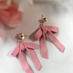 Pink bow dangle earrings