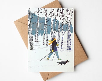 Kaart Winterwandeling met tekkel - Collage illustratie gemaakt van gerecycled papier - Winterkaart met hond