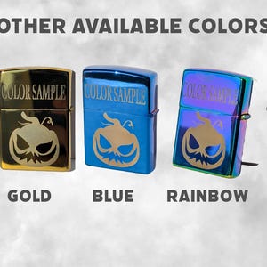 May include: A collection of five lighters in various colors: silver, gold, blue, rainbow, and black ice. Each lighter features a pumpkin face design and the text "COLOR SAMPLE".