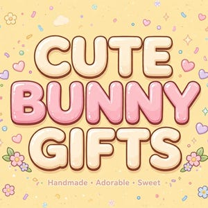 May include: A rectangular graphic with a pale yellow background featuring the text CUTE BUNNY GIFTS in large, rounded, cream-colored letters with pink accents. The design includes small bunny ears, flowers, hearts, and sprinkles scattered throughout.