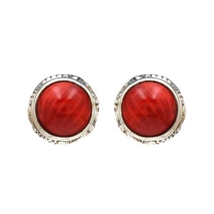 May include: A pair of silver earrings with red coral stones. The stones are round and have a textured surface.