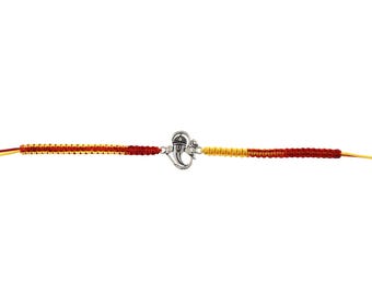 May include: A silver-colored charm bracelet with a central decorative element and red, yellow, and orange woven cord. The bracelet is designed with a symmetrical pattern and a clasp closure.