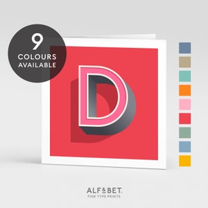May include: A pink and grey letter D with a 3D effect on a red background. The text "ALF&BET. FINE TYPE PRINTS" is at the bottom of the image. There are nine colour swatches to the right of the image.