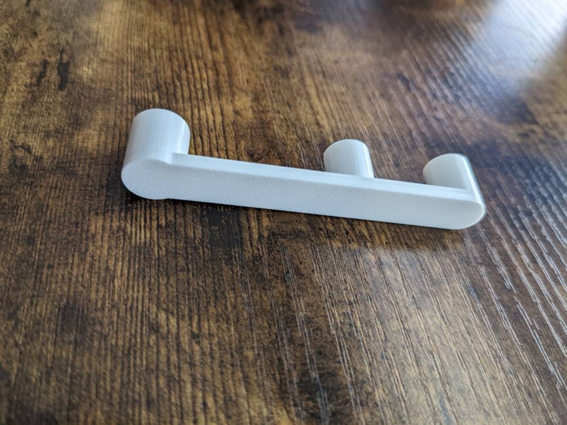 End Cap for Rubbermaid Freeslide Wire Shelf Keeps Hangers Where They