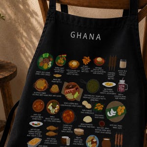 Ghana Food Apron featuring colorful illustrations of Jollof Rice, Kelewele, Fufu, Grilled Tilapia, Groundnut Soup, and Sobolo. Vibrant West African cuisine apron celebrating Ghana’s bold flavors and rich culture. Made from durable polyester canvas, perfect for home cooks and African food lovers. Ideal gift for foodies and travelers inspired by Ghanaian street food.