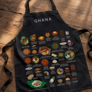 Ghana Food Apron featuring colorful illustrations of Jollof Rice, Kelewele, Fufu, Grilled Tilapia, Groundnut Soup, and Sobolo. Vibrant West African cuisine apron celebrating Ghana’s bold flavors and rich culture. Made from durable polyester canvas, perfect for home cooks and African food lovers. Ideal gift for foodies and travelers inspired by Ghanaian street food.