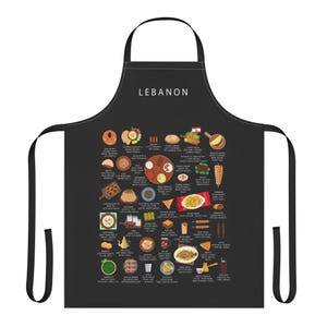 May include: Black apron featuring a detailed illustration of Lebanese cuisine. The apron displays various dishes with their names, and the word "LEBANON" is printed at the top. The apron has black ties and a neck strap.