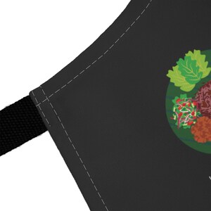 Ghana Food Apron featuring colorful illustrations of Jollof Rice, Kelewele, Fufu, Grilled Tilapia, Groundnut Soup, and Sobolo. Vibrant West African cuisine apron celebrating Ghana’s bold flavors and rich culture. Made from durable polyester canvas, perfect for home cooks and African food lovers. Ideal gift for foodies and travelers inspired by Ghanaian street food.