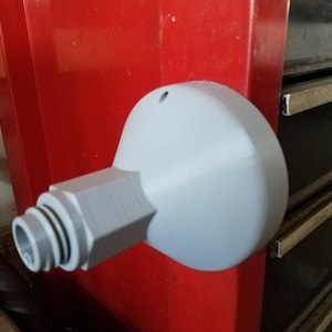 May include: A white plastic 3D printed adapter with a threaded connector and a round base. The adapter is mounted to a red surface.