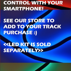 May include: A close-up of a track lighting system with a curved design. The lights are shown in red, blue, and green. The text "SHOWN WITH ADD-ON LED + STANDOFF KIT OPTION!" is displayed in white. The text "COLOR IS INFINITELY ADJUSTABLE, CONTROL WITH YOUR SMARTPHONE!" is displayed in white. The text "SEE OUR STORE TO ADD TO YOUR TRACK PURCHASE :)" is displayed in white. The text "<<LED KIT IS SOLD SEPARATELY>>" is displayed in white.