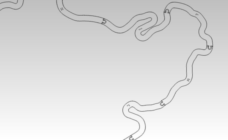 May include: A black and white line drawing of a race track with numbered turns. The track is shaped like a figure eight with a long straight section in the middle.