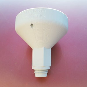 May include: White plastic funnel with the text "Cobra Industries" printed on the top. The funnel has a small hole in the top and a threaded opening at the bottom.