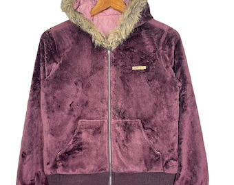 May include: A burgundy zip-up jacket with a faux fur hood. The jacket has a small gold logo that says "O'Neill" on the front.