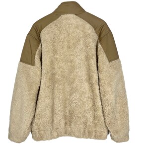 May include: A beige fleece jacket with brown fabric panels on the shoulders and arms. The jacket has a high collar and a zipper closure.