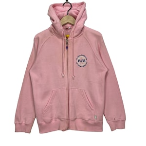 May include: Pink zip-up hoodie with a blue and white logo that says "La Jolla California PJ's La Jolla California".