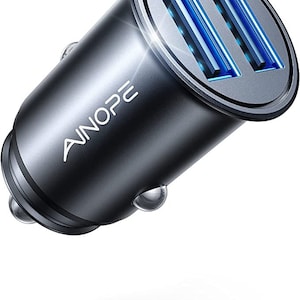 May include: A silver car charger with two USB ports and blue LED lights. The charger has the text "AINOPE" on the side.
