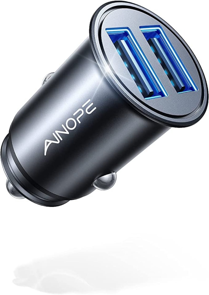 May include: A silver car charger with two USB ports and blue LED lights. The charger has the text "AINOPE" on the side.