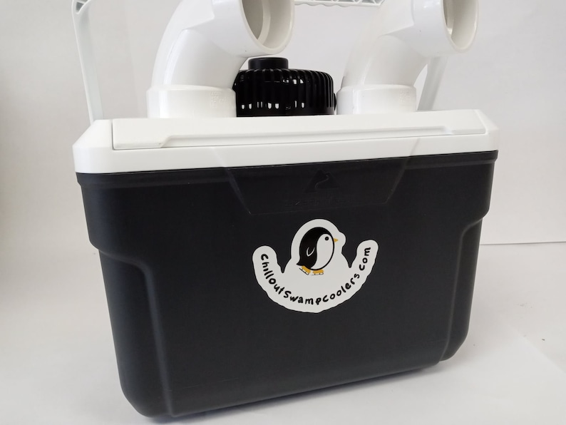 May include: A black and white cooler with a white lid and a white penguin logo that says "Chillout Swamp Coolers.com".