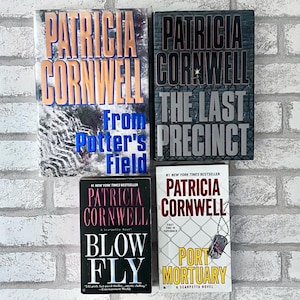 May include: Four books by Patricia Cornwell: From Potter's Field, The Last Precinct, Blow Fly, and Port Mortuary. The covers feature various graphic designs including barbed wire, a dog tag, and bold text in blue, black, red, and yellow.