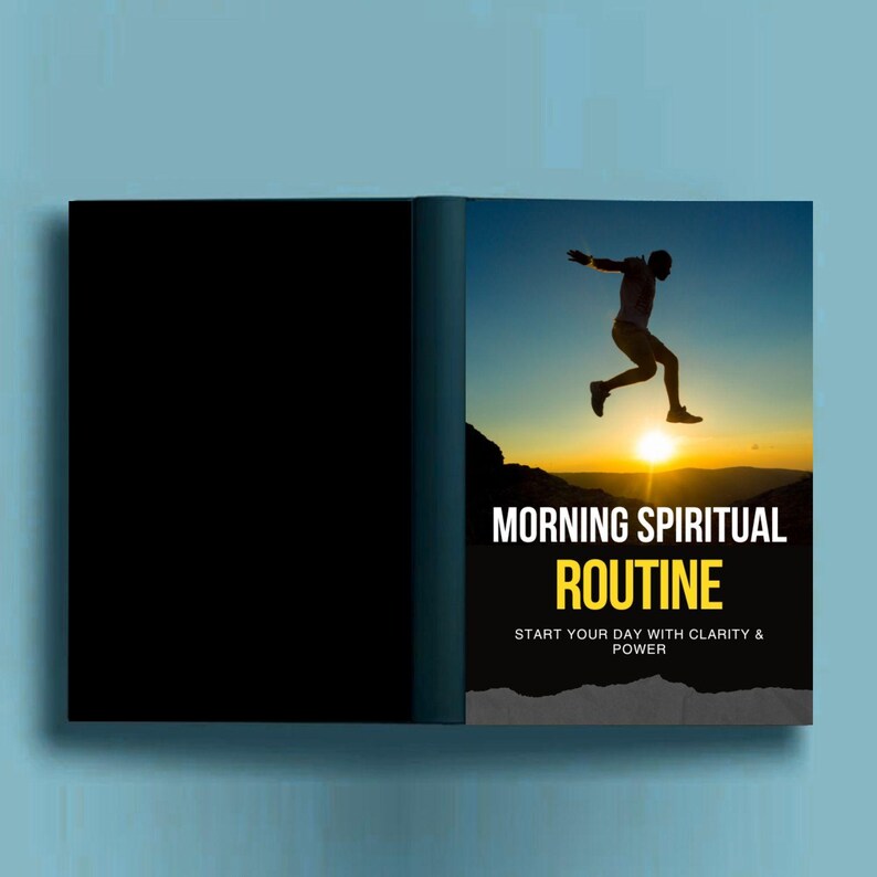 May include: A book with a black cover and a vibrant image of a person leaping at sunrise. The book's title is "MORNING SPIRITUAL ROUTINE" in white and yellow text. The tagline reads "START YOUR DAY WITH CLARITY & POWER."