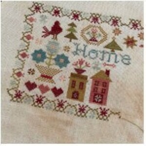 May include: A cross-stitch embroidery featuring a colorful scene with houses, trees, birds, flowers, and the word "Home".