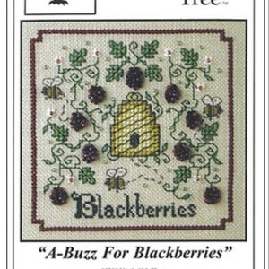 May include: Cross stitch pattern featuring a beehive surrounded by blackberries and bees. The pattern is titled "A-Buzz For Blackberries" and is from The Sweetheart Tree.