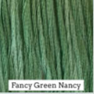 May include: A skein of green embroidery floss with the text "Fancy Green Nancy" printed on the label.
