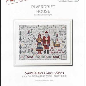May include: A framed cross-stitch pattern titled "Santa & Mrs Claus Folkies." The design features Santa and Mrs. Claus in folk art style, surrounded by Christmas motifs. The image includes text from "Creative Poppy" and "Riverdrift House Needlework Designs."