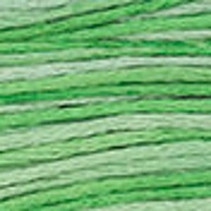 May include: A skein of green and white ombre yarn. The yarn is soft and fluffy, perfect for knitting or crocheting.
