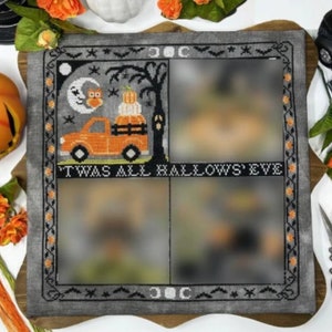 May include: A gray and black cross-stitch sampler with a Halloween theme. The sampler features a truck carrying pumpkins, an owl, and the text "'Twas All Hallows' Eve".