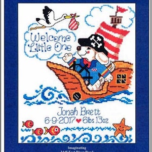 May include: A cross-stitch pattern for a baby's birth announcement. The design features a cute cartoon pirate dog on a ship with a stork carrying a baby in a bag. The text reads "Welcome Little One" and "Jonah Brett 6-9-2017 6lbs 13oz".