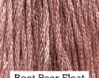 May include: A close-up of a spool of pink yarn with the text "Root Beer Float" printed on the label.