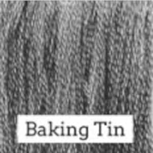 May include: A silver baking tin with the words "Baking Tin" printed on the front.