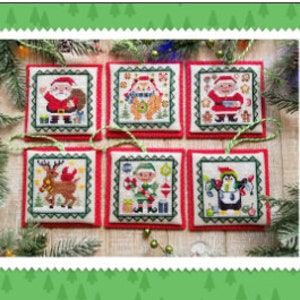 May include: Six handmade Christmas ornaments featuring various holiday characters, including Santa Claus, a reindeer, an elf, a penguin, and a snowman. The ornaments are all square and have a red background with green trim.