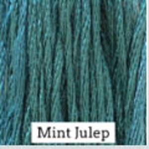 May include: A spool of teal blue embroidery floss with the text "Mint Julep" printed on the label.