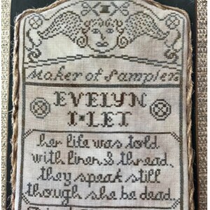 May include: A framed sampler with a white background and brown embroidery. The sampler features a poem about life and death, and is signed "Evelyn T*Let, Maker of Samplen, Died June 5, 1848."
