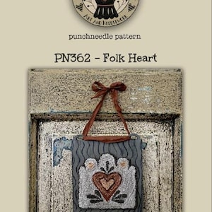 May include: Punch needle pattern for a folk heart design. The pattern is on a gray background with a red heart and white accents. The finished piece measures 4 inches by 3 3/4 inches.