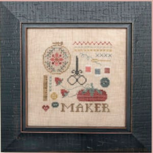 May include: Cross stitch pattern featuring a variety of sewing tools, including a needle, thread, scissors, buttons, and a ruler. The pattern also includes a heart and the word "MAKER".