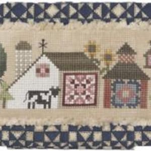 May include: A cross-stitch sampler featuring a rural village scene with barns, trees, and a cow. The design includes a blue and white geometric border and a frayed edge. The color palette includes red, green, and beige.