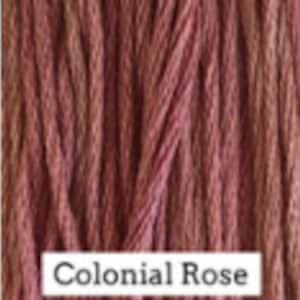 May include: A close-up of a spool of embroidery floss in a muted pink color called "Colonial Rose".