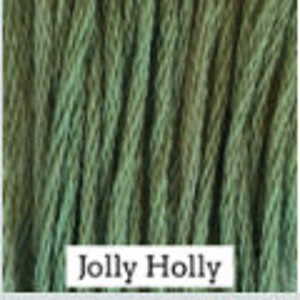May include: A skein of green and brown ombre cotton yarn with the text "Jolly Holly" printed on the label.