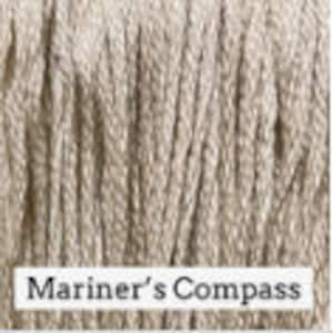 May include: A close-up of a beige rope with a woven texture. The rope is labeled "Mariner's Compass".