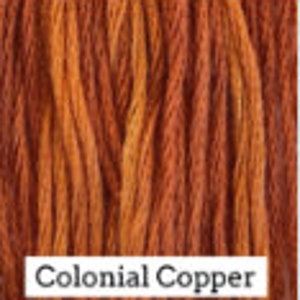 May include: A spool of embroidery floss in a warm, reddish-brown color called "Colonial Copper".