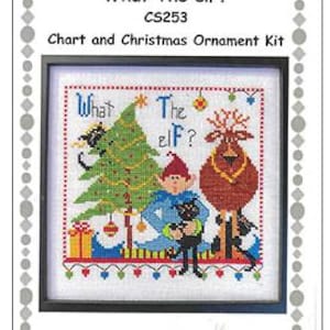 May include: Cross-stitch kit featuring a framed design with the text "What The elf?" and a Christmas theme. The image includes a Christmas tree, an elf, a reindeer, and a black cat. The kit is labeled "Chart and Christmas Ornament Kit."